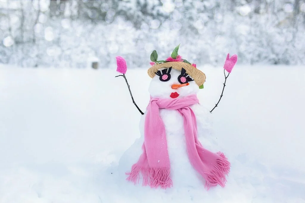 Snowwoman names - A cute snowlady with a pink scarf
