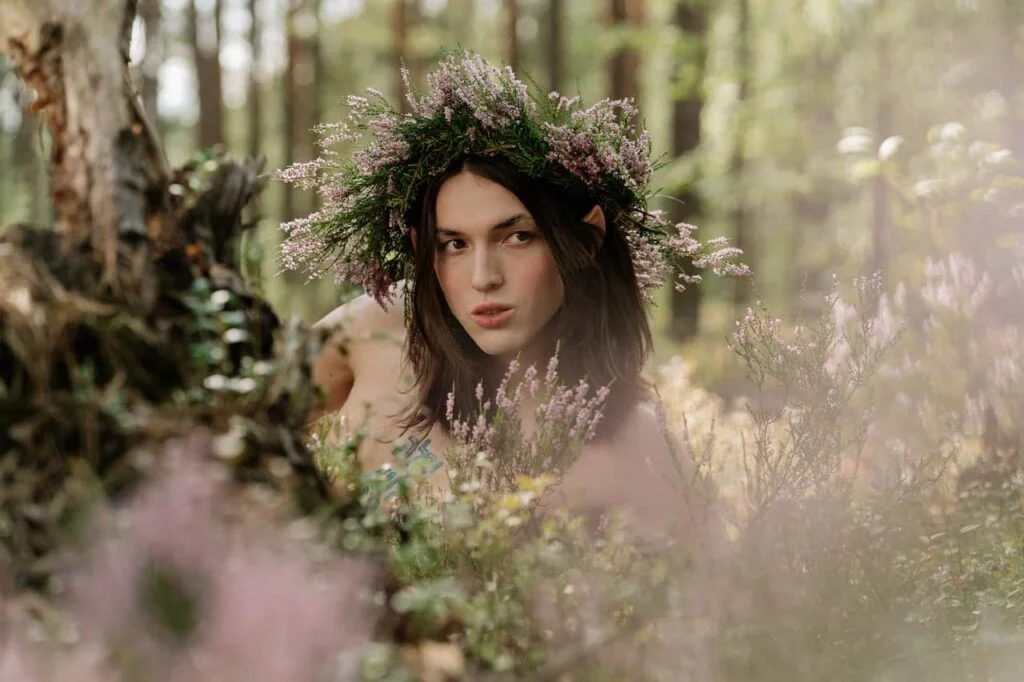 Half-elf male names - A male elf wearing a wreath in a forest